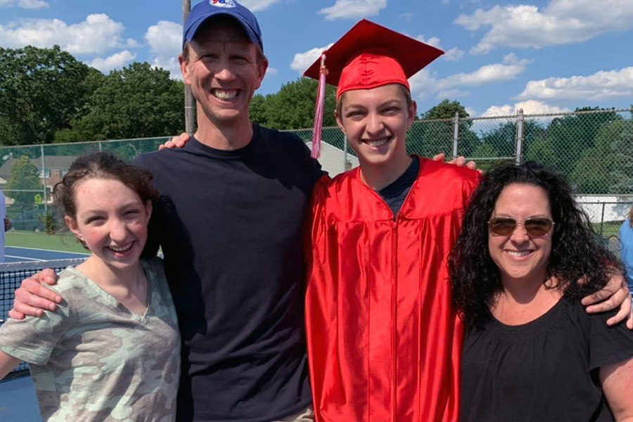 Jim McManmon and his family at a graduation ceremony.
